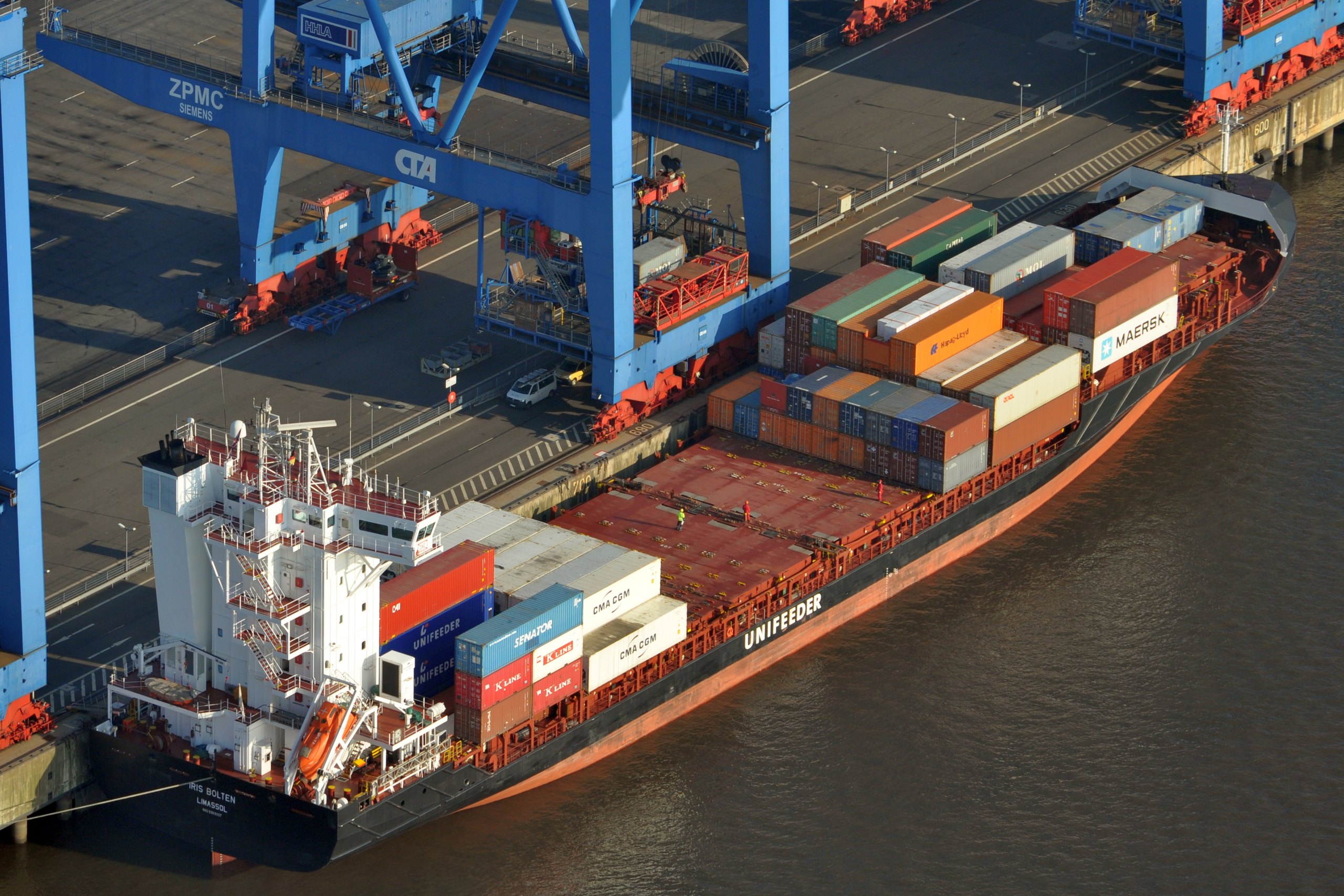Aerial view of a container ship being loaded at a port terminal