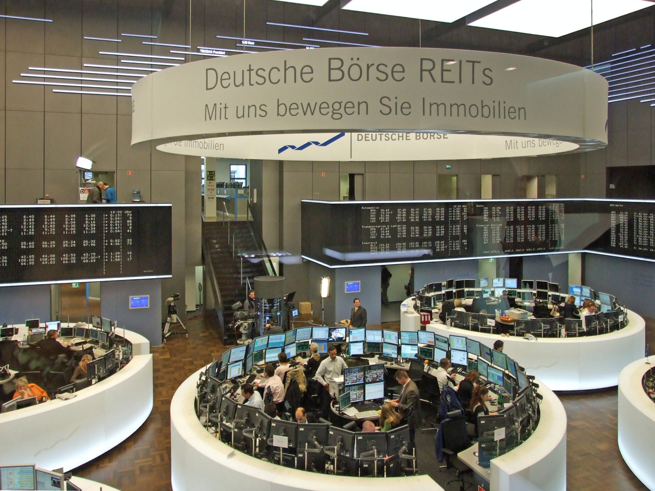 Traders at screens on a stock exchange trading floor