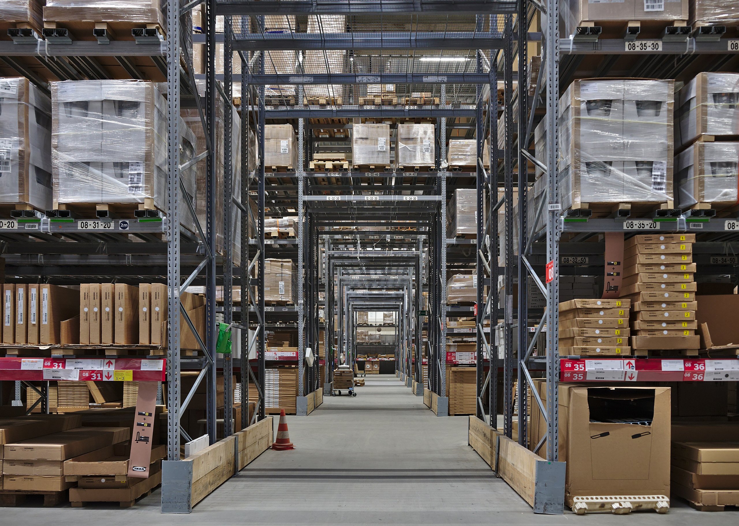 Warehouse aisles with stocked pallet racking